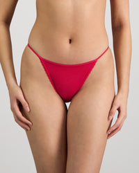 Model wears Skinlite Tanga in JAZZY. On body front view