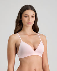 Model wears Simply Seamless Wire Free Bra in ICY PINK/WHITE STRIPE. On body side view