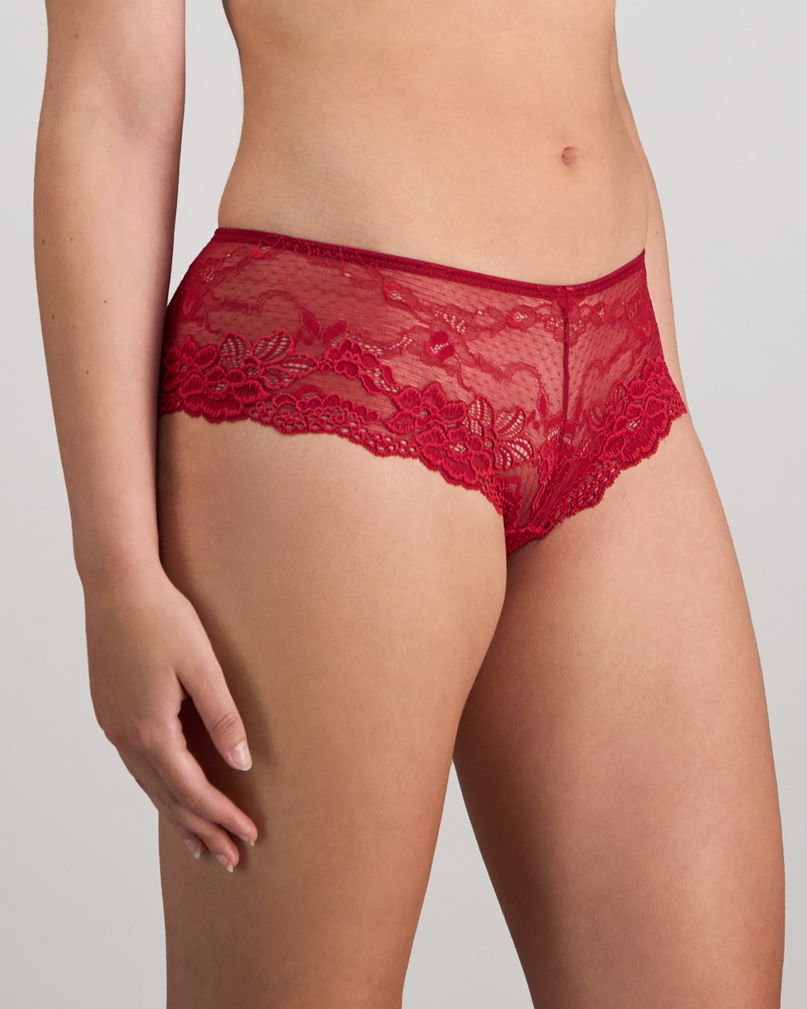 Model wears My Fit Lace Brazilian in JESTER RED. On body side view