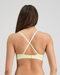 Model wears Simply Seamless Wire Free Bra in TRANSPARENT YELLOW. On body back view
