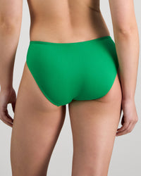 Model wears Juniper Bikini in PARADISE GREEN. On body back view