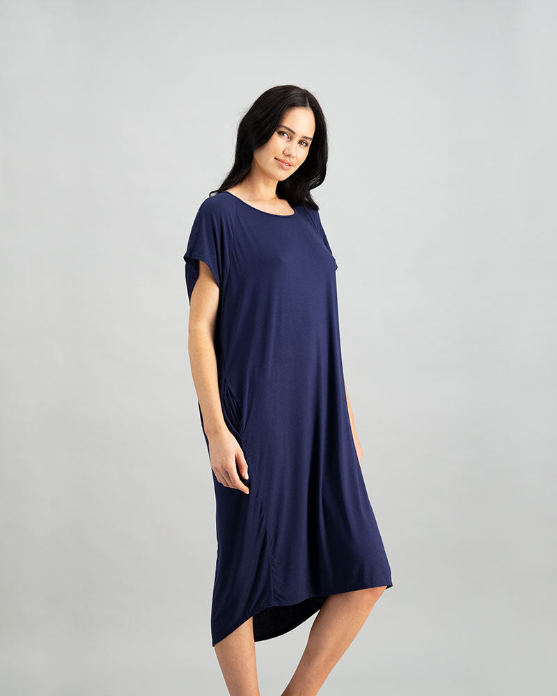 Model wears Belle Bamboo Nightie in EVENING BLUE. On body side view