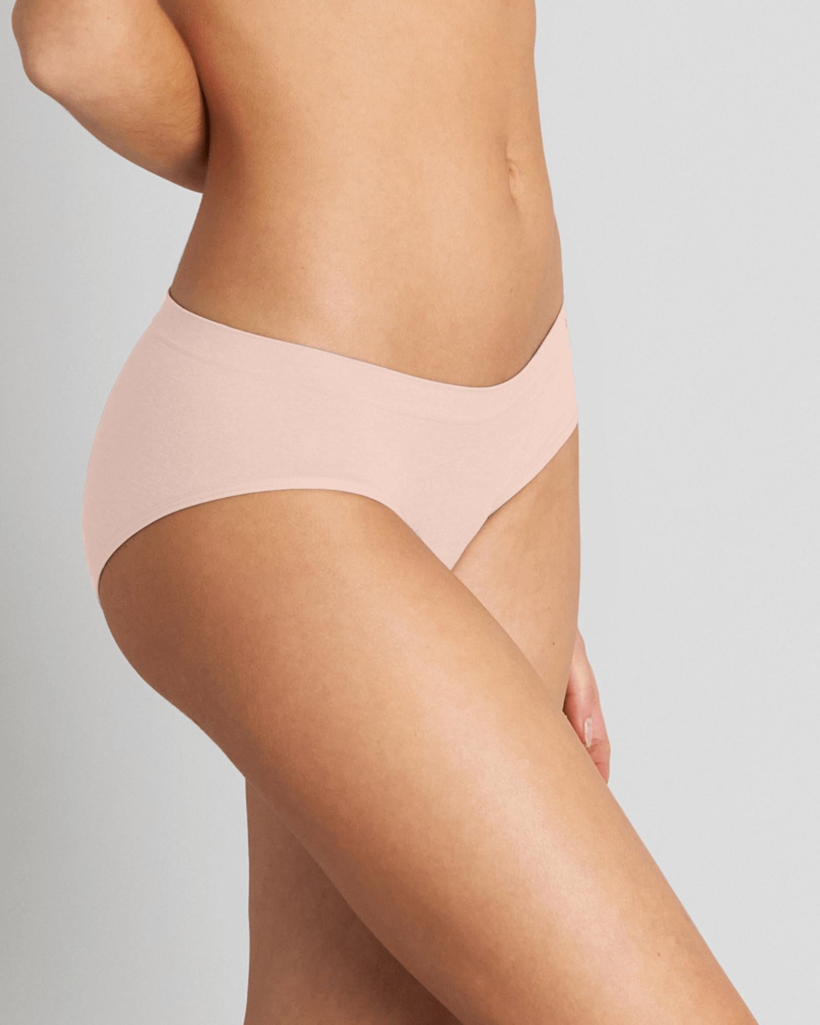 Model wears Simply Seamless Boyshort in SILVER PINK. On body side view