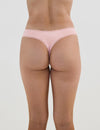 Model wears Stretch Cotton Thong in ICY PINK. On body back view
