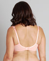 Model wears Alice Underwire Bra in PEACH BUD. On body back view