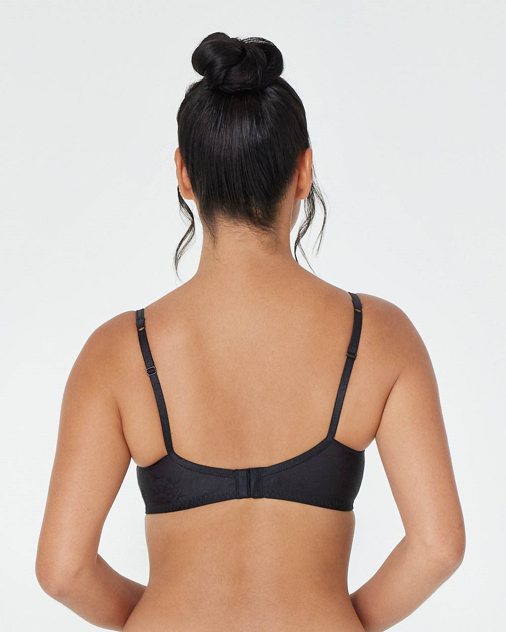 Model wears Body Lace Contour Bra in BLACK. On body back view