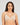 Model wears Manifest Underwire Bra in LATTE. On body front view