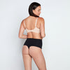 Model wears Medium Control Thong in BLACK. On body back view