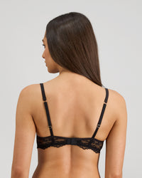 Model wears Oasis Glow Underwire Bra in BLACK. On body back view