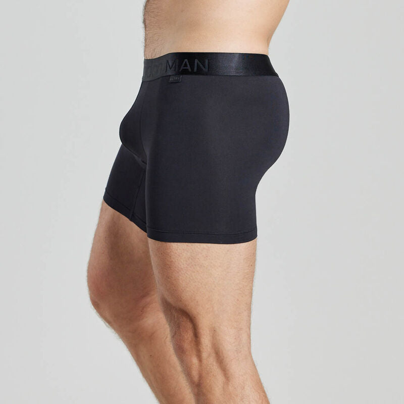 Model wears Bamboo Mens Trunk in BLACK. On body side view
