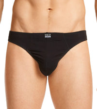 Model wears Cotton Stretch Mens Thong in BLACK. On body front view