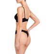 Model wears Body Lace Thong in BLACK. On body back view