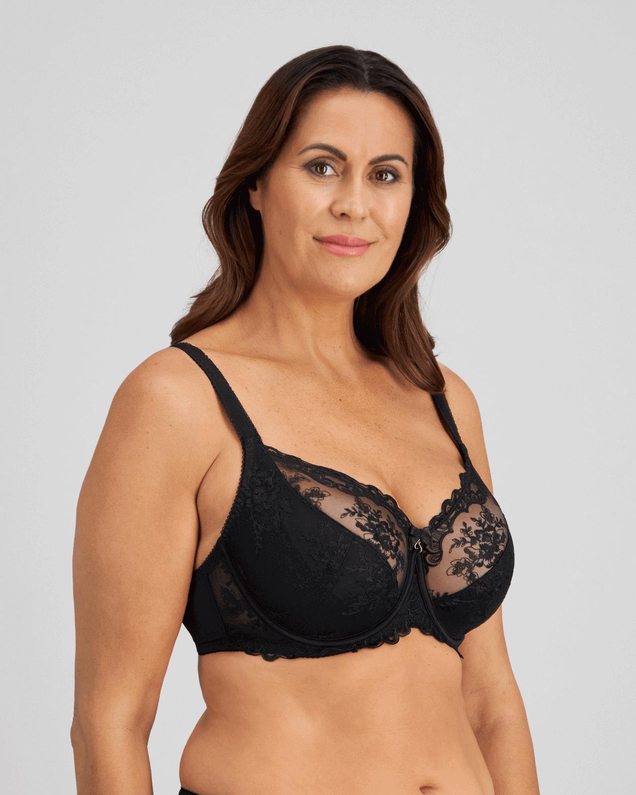 Model wears Mesmerise Underwire Bra in BLACK. On body side view