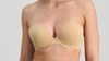 Hero banner Beige strapless bra worn by a person on a plain background
