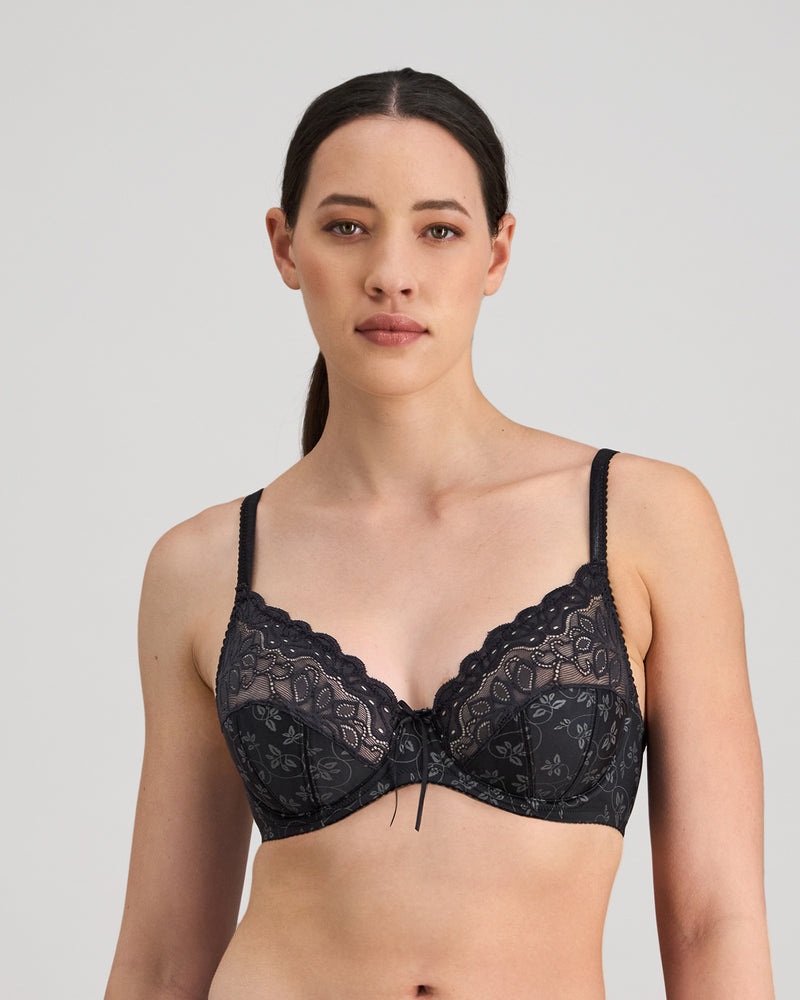 Model wears Yvette Underwire Bra in BLACK. On body front view