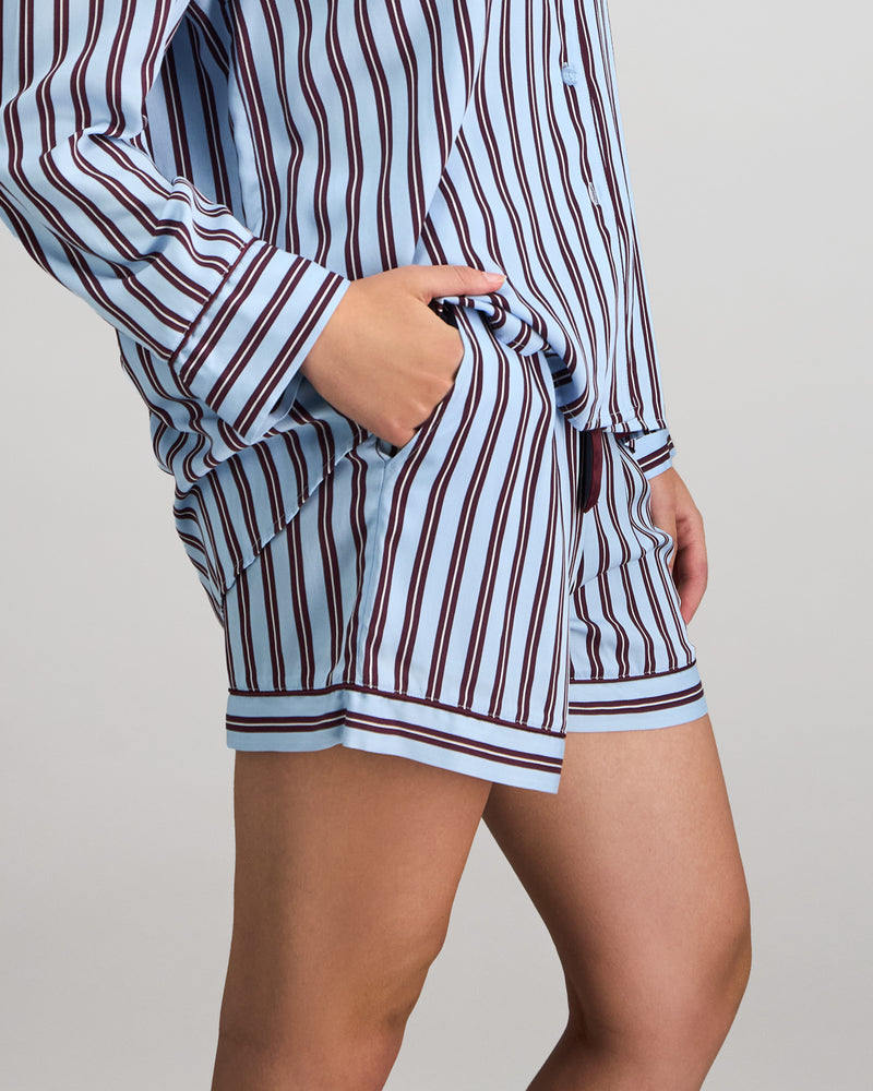 Model wears Cabana Stripe Short Pj in COOL BLUE. On body side view
