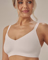 Model wears Comfit Collection Wire Free Bra in WHITE. On body side view