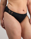 Model wears Coral High Cut Brief in BLACK. On body side view