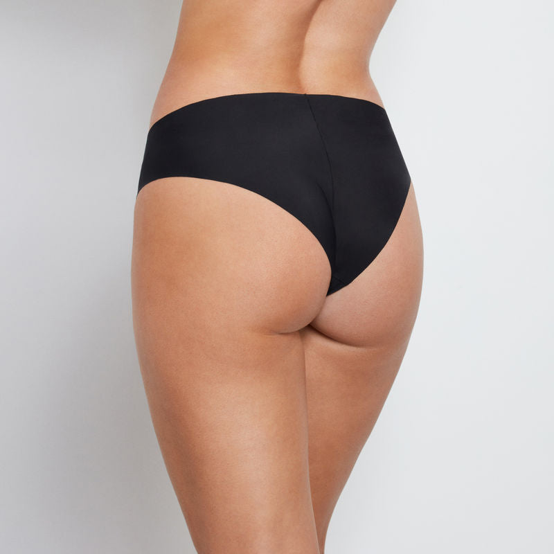 Model wears No Show Bikini in BLACK. On body back view