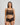 Model wears Oasis Glow Camisole in BLACK. On body front view