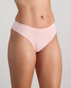 Model wears Seamless Soft Thong in ICY PINK. On body side view