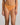Model wears My Fit Underlayer Thong in TANGERINE. On body front view