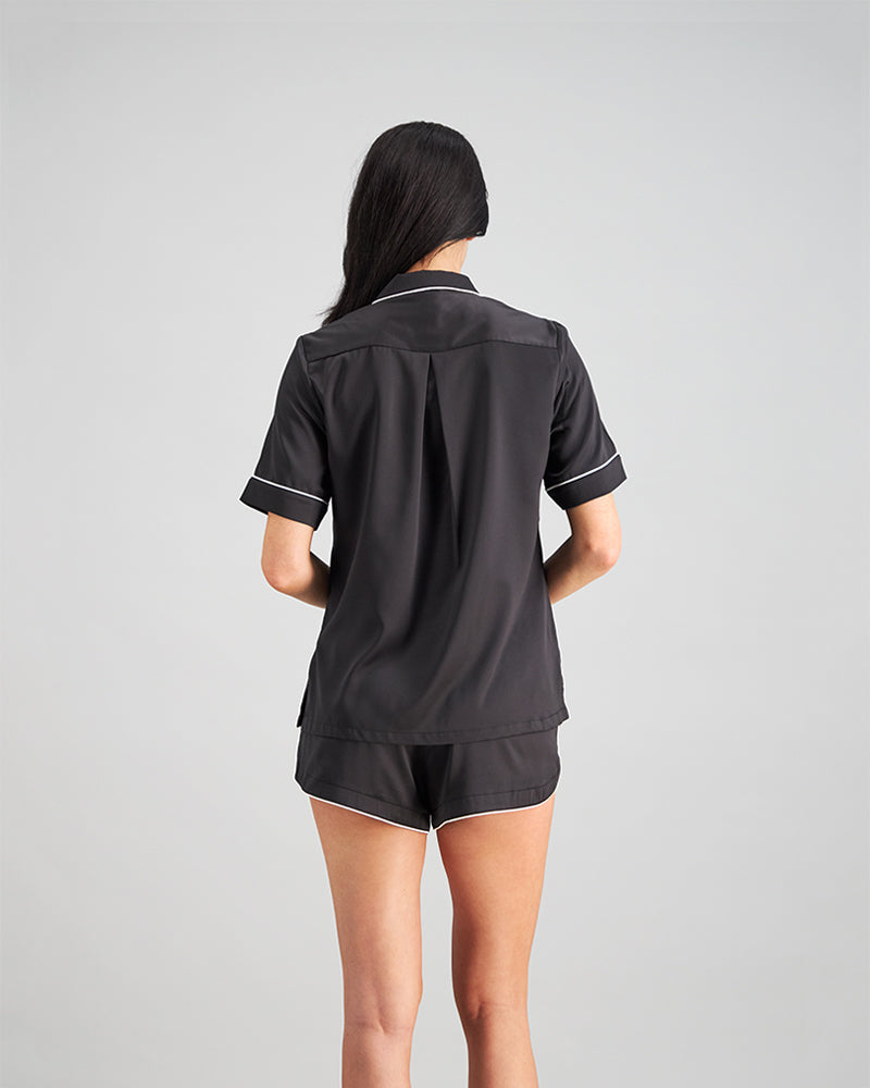 Model wears Holly Short PJ in BLACK/CREAM. On body back view
