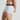 Model wears Organic Cotton Mens Trunk in LIGHT GREY MARL. On body side view