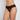 Model wears Lace Thong in BLACK. On body front view
