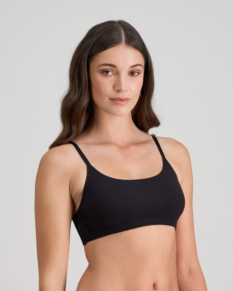 Model wears Extra-Ordinary Crop Top in BLACK. On body side view