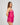 Model wears Eva Jean Short in FANTASY FUCHSIA. On body front view
