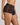 Model wears Lace Impact Short in BLACK. On body side view