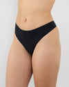 Model wears Au Naturel Thong in BLACK. On body side view
