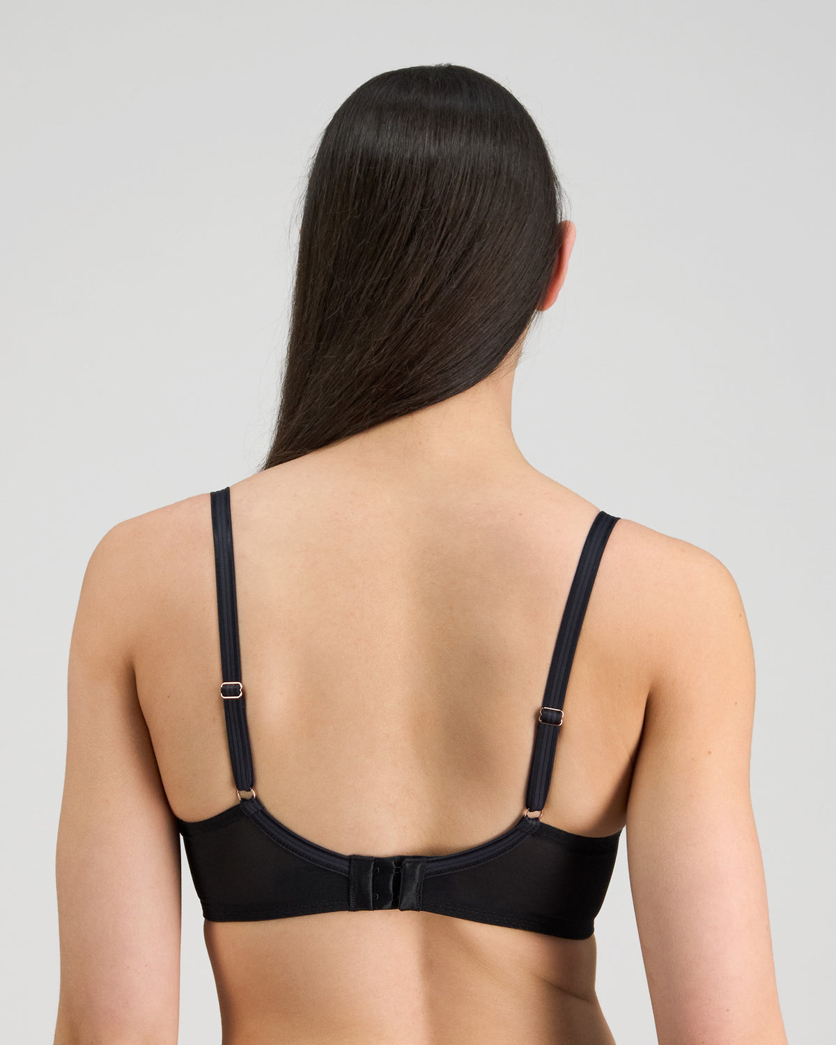 Model wears Sheer Essence Underwire Bra in BLACK. On body back view