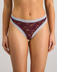 Model wears Leo Thong in FIG/SKYWAY. On body front view