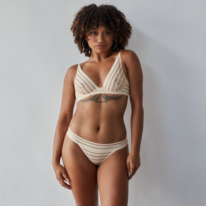 Model wears Morning Lola Underwire Bra in SCALLOP SHELL. On body front view