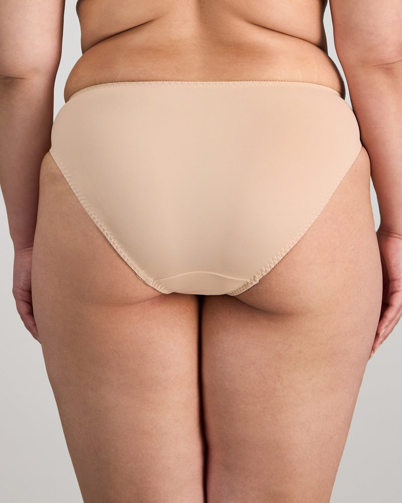 Model wears Coral High Cut Brief in LATTE. On body back view