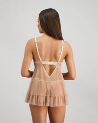 Model wears Flirt In Paradise Babydoll in SUGAR. On body back view