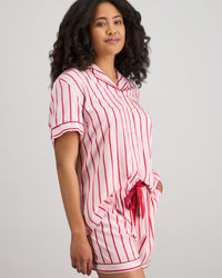 Model wears Cabana Stripe Short Pj Set in CANDY CANE. On body side view