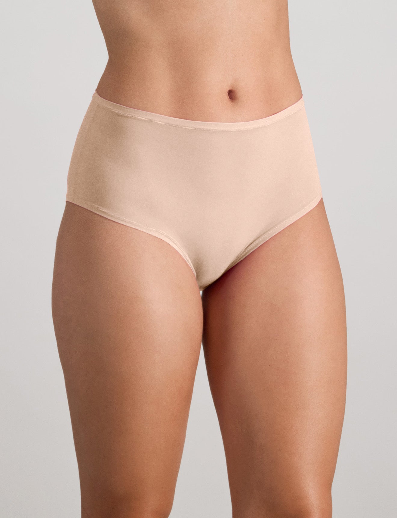Model wears Extra-Ordinary Full Brief in LATTE. On body side view