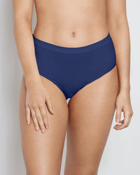 Model wears Seamless Soft Full Brief in Medieval Blue. On body front view