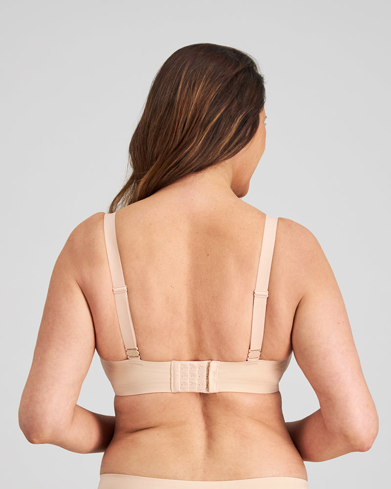 Model wears Comfit Collection Wire Free Bra in LATTE. On body back view