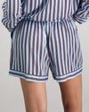 Model wears Cabana Stripe Short Pj in COOL BLUE. On body back view