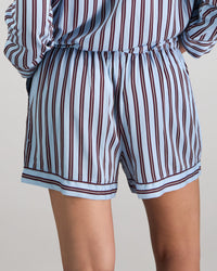 Model wears Cabana Stripe Short Pj in COOL BLUE. On body back view