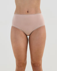 Model wears Stretch Cotton Full Brief in LATTE. On body front view