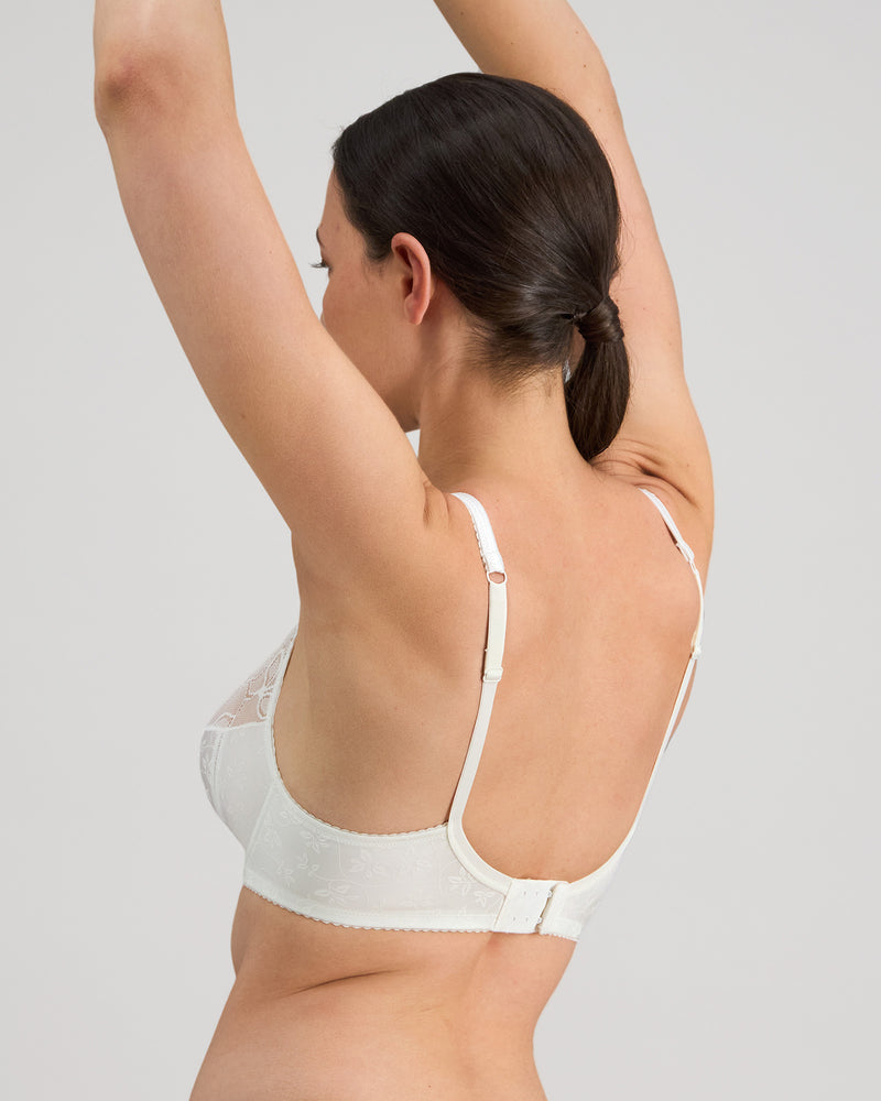Model wears Yvette Underwire Bra in WHITE. On body side view