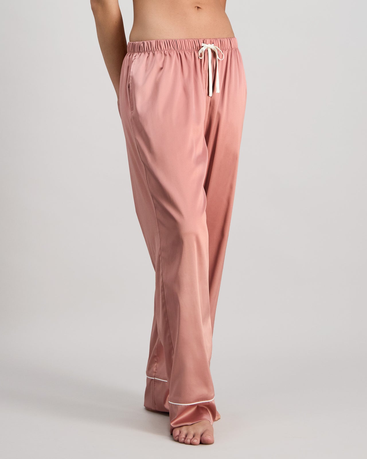 Model wears Holly Long PJ Pant in ASH ROSE. On body side view