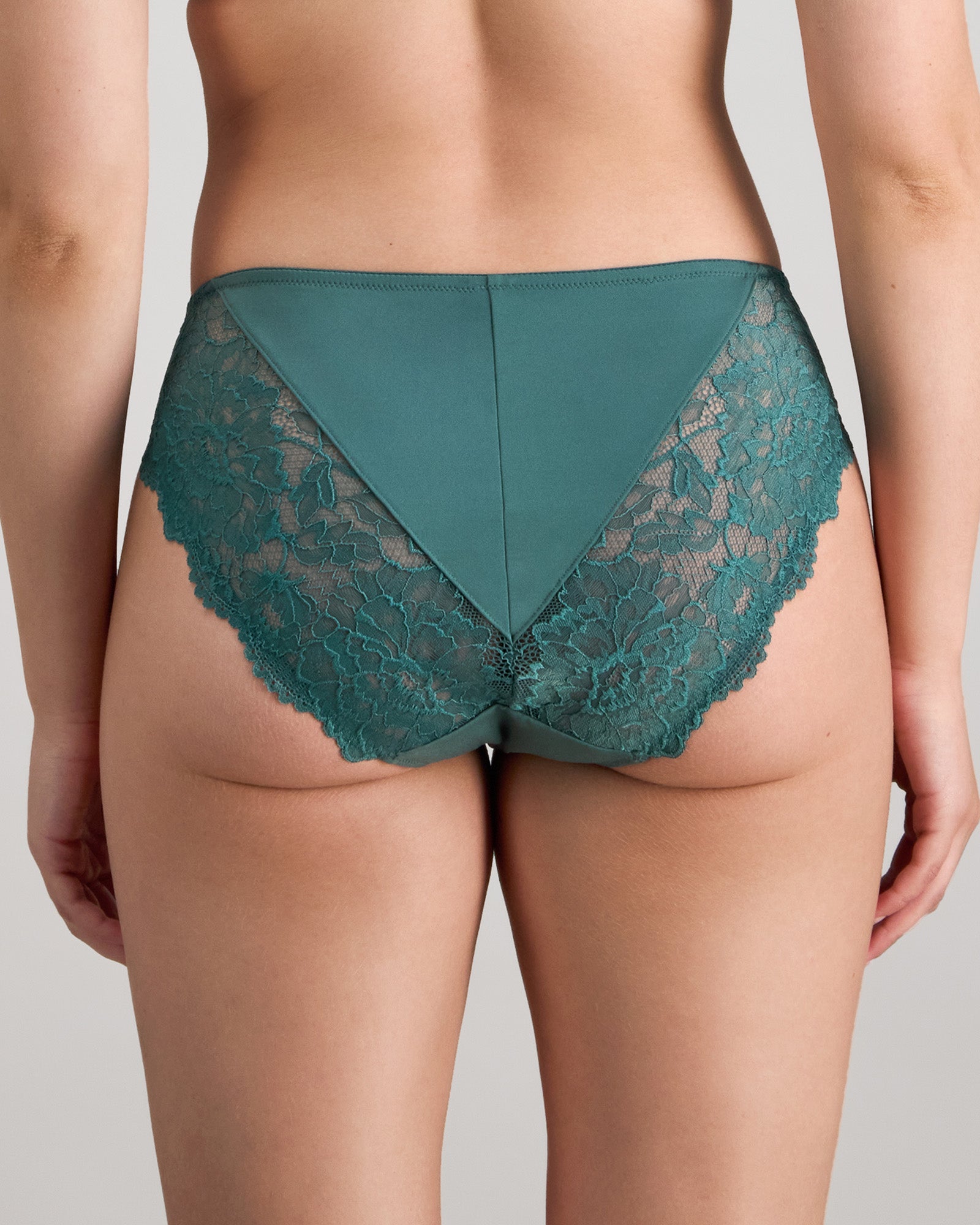 Model wears Laurel High Cut Brief in MEDITERRANEA. On body back view