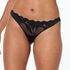 Model wears Sienna Siesta Thong in BLACK. On body front view