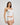 Model wears Body Cocoon Camisole in WHITE. On body side view